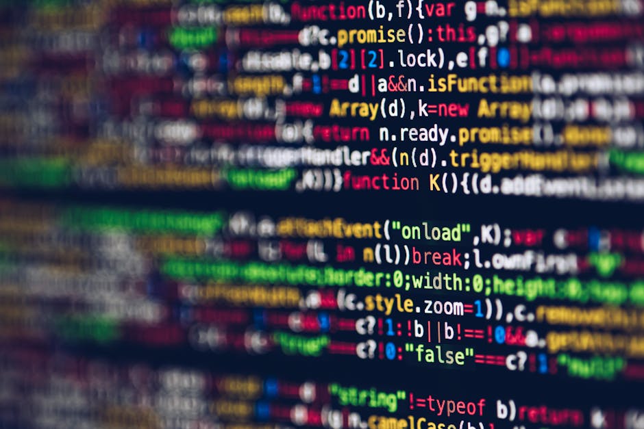 A close-up view of a computer screen displaying colorful lines of programming code, with various syntax elements such as functions, variables, and conditional statements in shades of red, blue, green,
